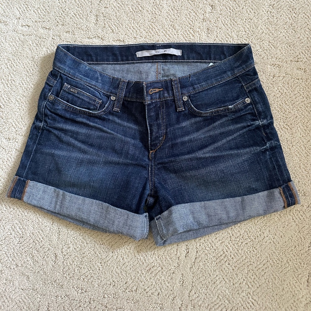 Darker wash jean shorts with rolled stitched hem